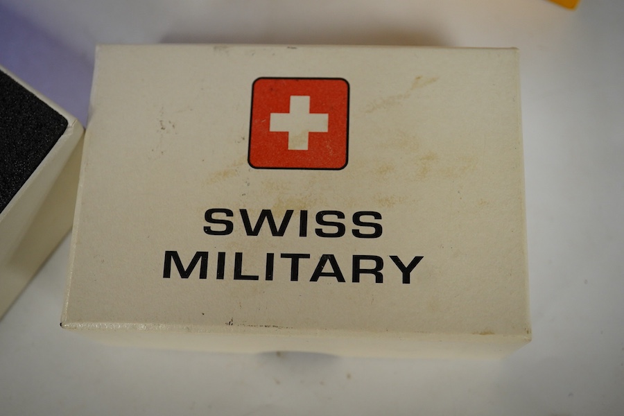 Sundry items comprising, two luxury wallets, boxed, Swiss military lighter and gent's manicure set. Condition - fair